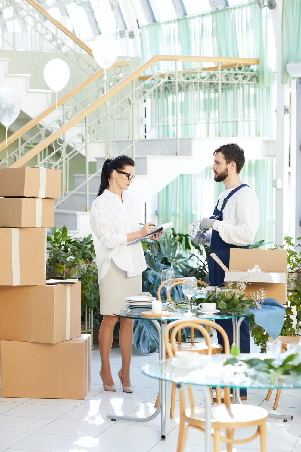 Business lady asking mover about delivery order